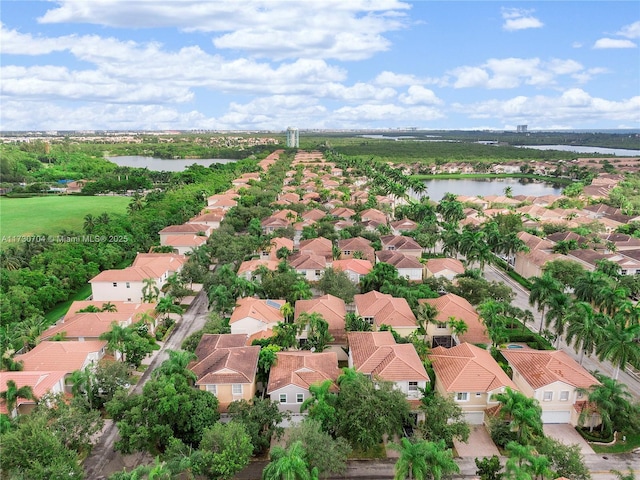 birds eye view of property featuring a residential view and a water view