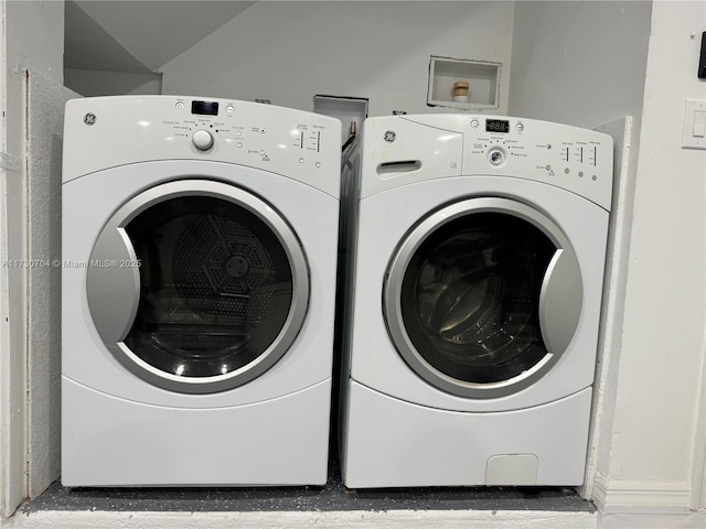 laundry area featuring laundry area and washing machine and dryer