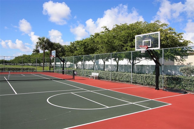 view of sport court featuring tennis court