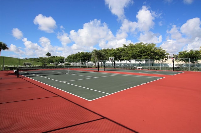 view of sport court featuring fence and community basketball court