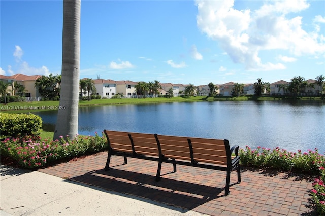 surrounding community with a residential view and a water view