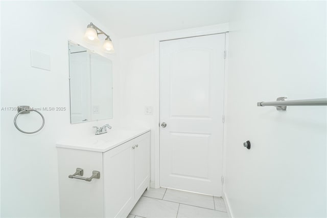 bathroom with tile patterned floors and vanity