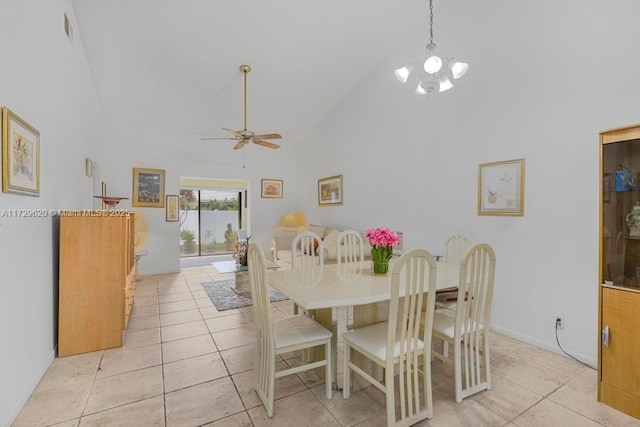 dining room featuring light tile patterned floors, ceiling fan with notable chandelier, and high vaulted ceiling