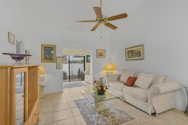 living room featuring light tile patterned floors, high vaulted ceiling, and ceiling fan