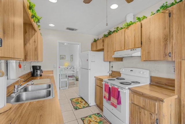 kitchen featuring sink, white appliances, light tile patterned floors, and ceiling fan