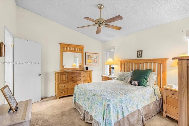 bedroom featuring ceiling fan, a textured ceiling, light carpet, and lofted ceiling