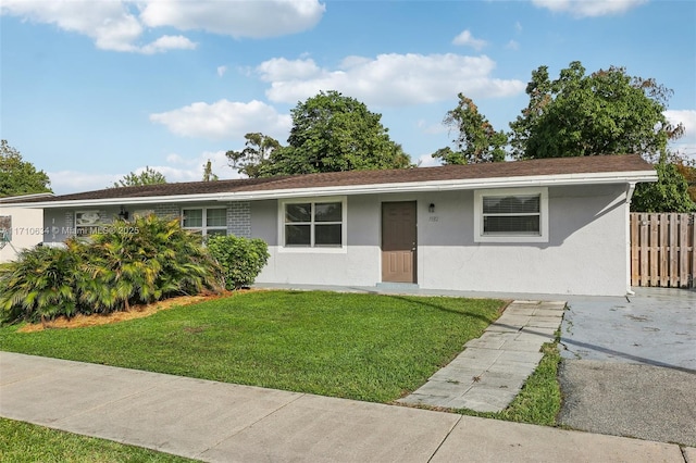 ranch-style house with a front yard