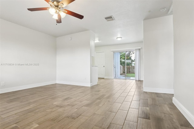 unfurnished room with light wood-type flooring and ceiling fan