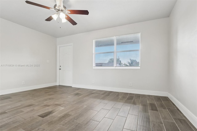 spare room with wood-type flooring and ceiling fan