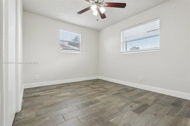 spare room with ceiling fan, a textured ceiling, and hardwood / wood-style floors