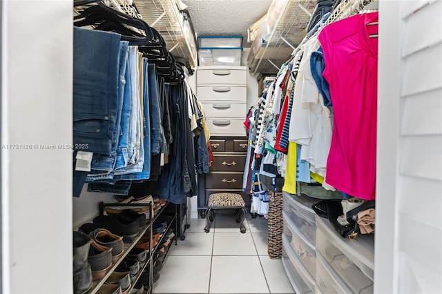 spacious closet featuring light tile patterned flooring