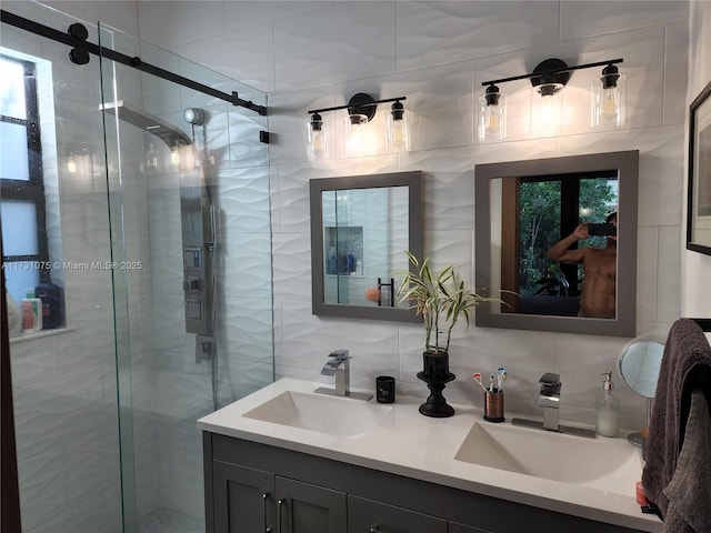 bathroom with backsplash, a shower with door, and vanity