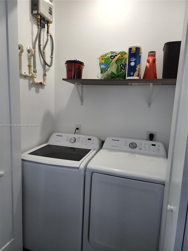 clothes washing area featuring independent washer and dryer