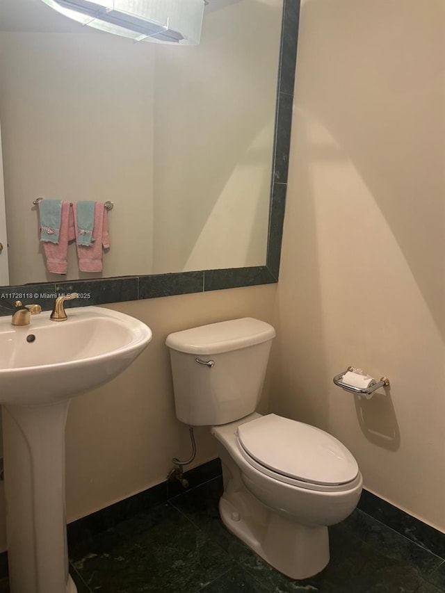 bathroom with sink and toilet