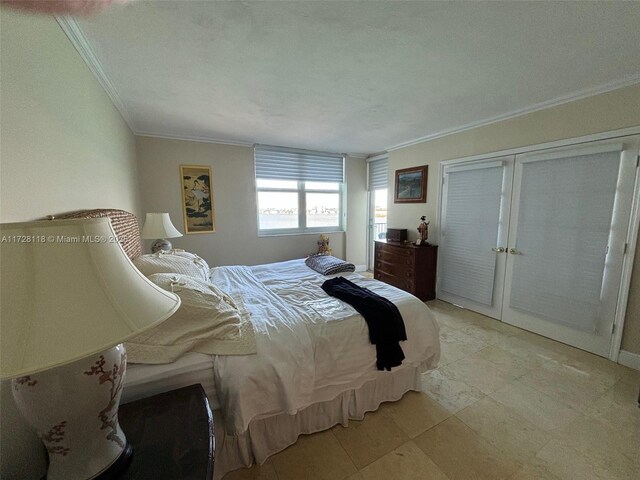 bedroom with crown molding