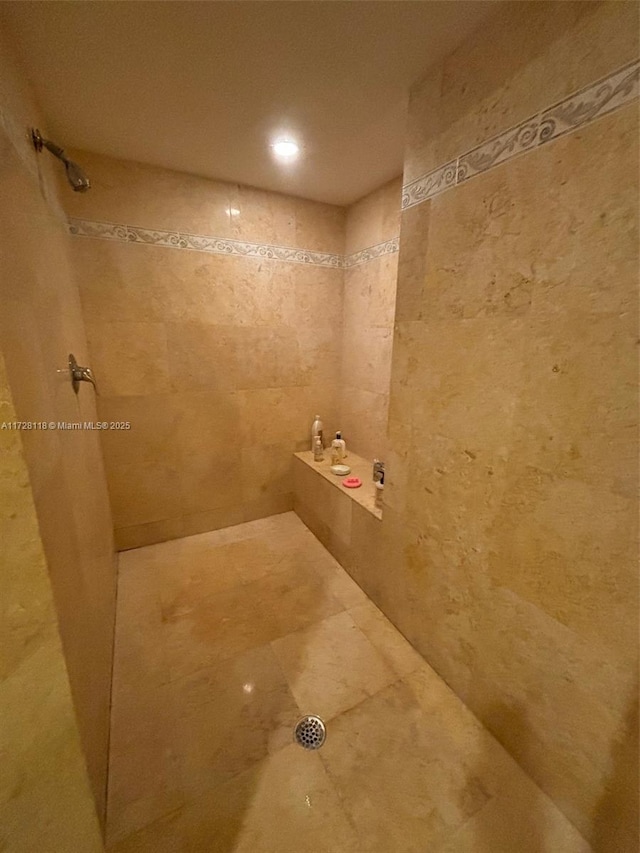 bathroom with tiled shower