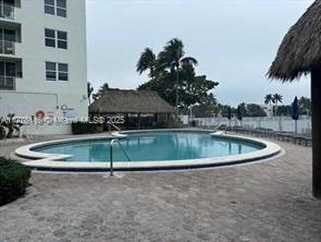 view of patio / terrace featuring a water view and a grill