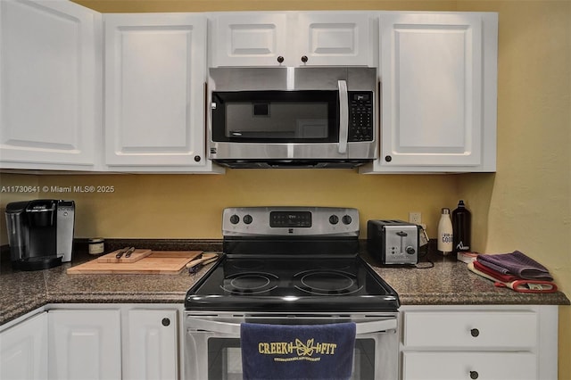 kitchen featuring white cabinets and appliances with stainless steel finishes