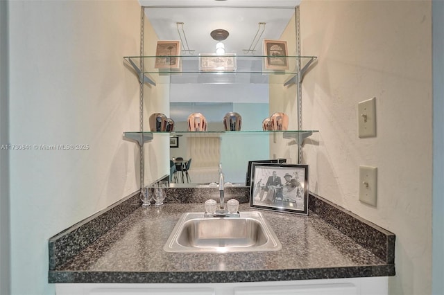 kitchen featuring sink and white cabinets