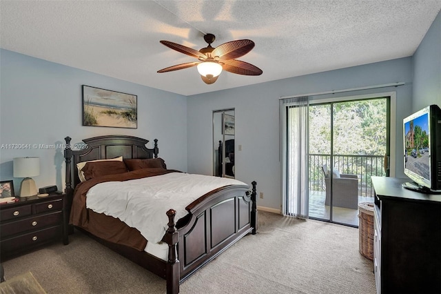 carpeted bedroom featuring ceiling fan, access to outside, and a textured ceiling