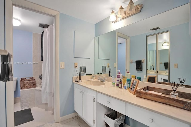 bathroom featuring tile patterned floors and vanity