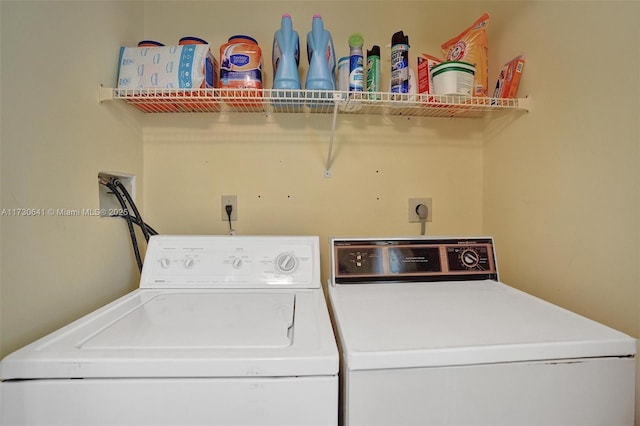 washroom featuring independent washer and dryer