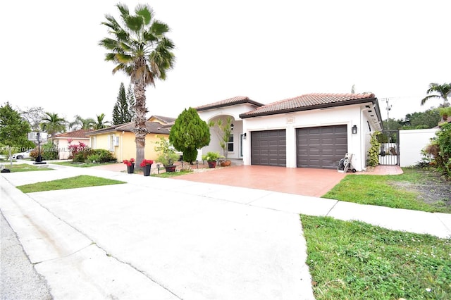 mediterranean / spanish-style home featuring a garage