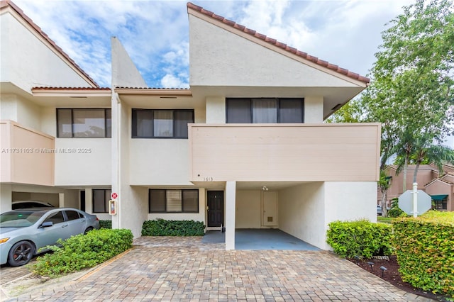 view of front of property with a carport