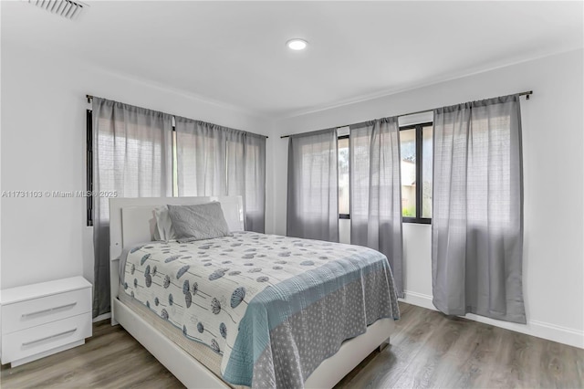 bedroom with wood-type flooring