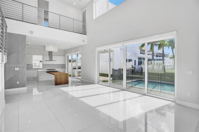 unfurnished living room with a high ceiling