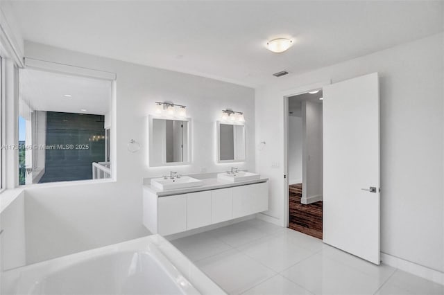 bathroom with vanity, shower with separate bathtub, and tile patterned floors