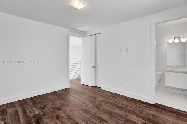 empty room with dark hardwood / wood-style floors