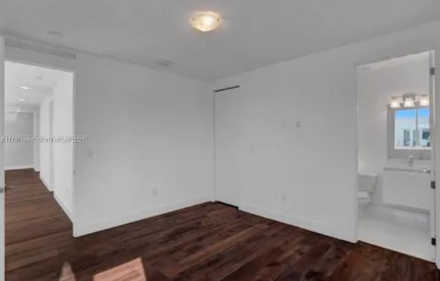 spare room featuring dark hardwood / wood-style floors