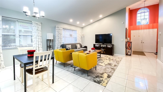 tiled living room featuring a notable chandelier and vaulted ceiling