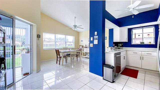 kitchen with sink, white cabinetry, light tile patterned floors, and a healthy amount of sunlight