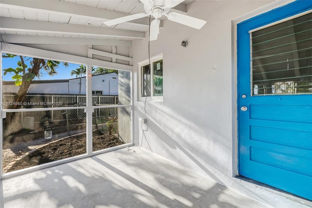 view of exterior entry with ceiling fan