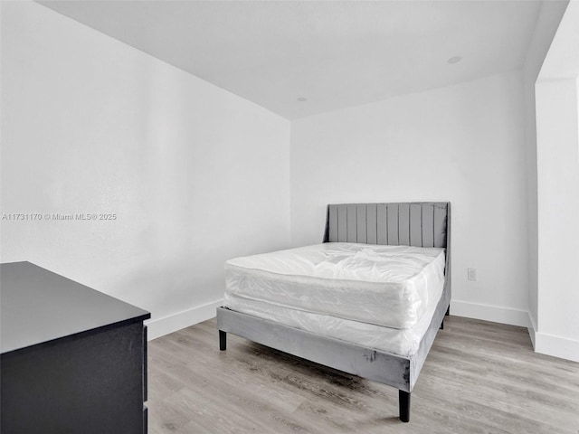 bedroom with light wood-type flooring