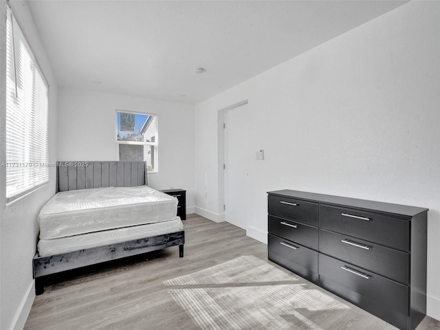 bedroom featuring light hardwood / wood-style flooring