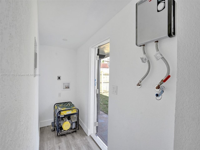 interior space with water heater and light hardwood / wood-style flooring