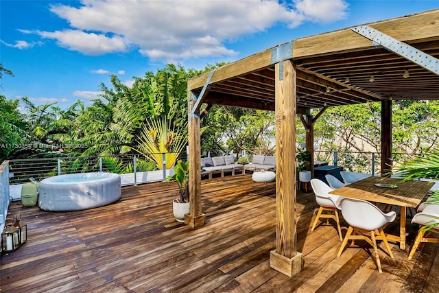 wooden deck with a hot tub and outdoor lounge area