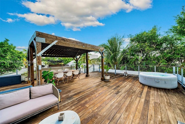 wooden terrace with outdoor lounge area, an outdoor bar, and a jacuzzi