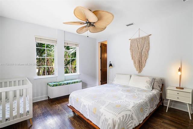 bedroom featuring dark wood-type flooring and ceiling fan