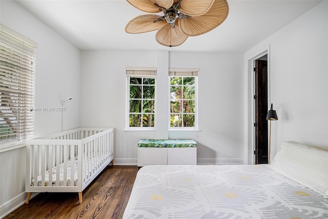 bedroom featuring ceiling fan and dark hardwood / wood-style flooring