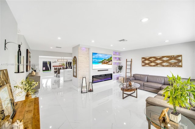 living room featuring recessed lighting, marble finish floor, and visible vents