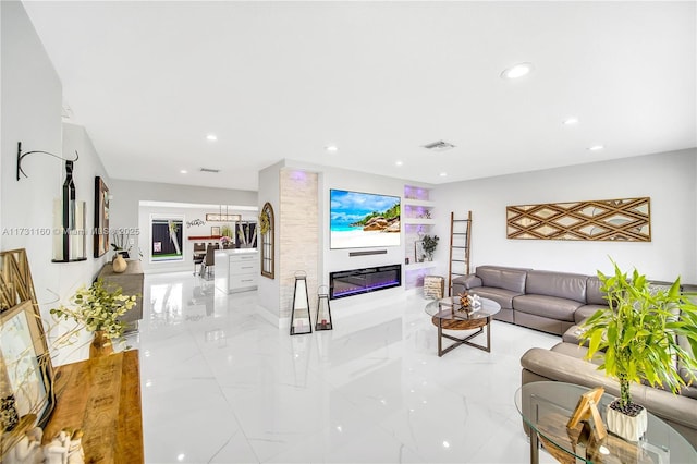 7900 SW 97th Ave, Miami, FL 33173 - living area featuring recessed lighting, marble tiled flooring, and a glass covered fireplace