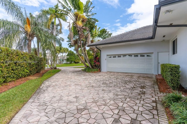 view of side of property featuring a garage