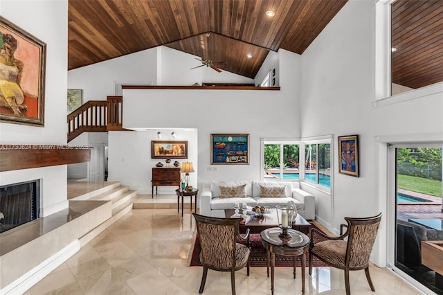 living room featuring high vaulted ceiling, wooden ceiling, and ceiling fan