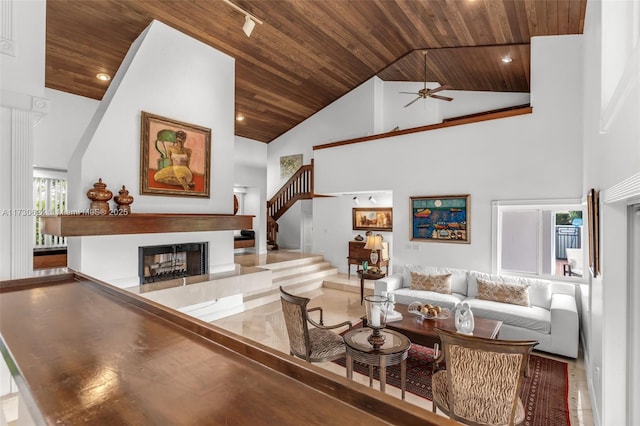 living room featuring high vaulted ceiling, wooden ceiling, and ceiling fan