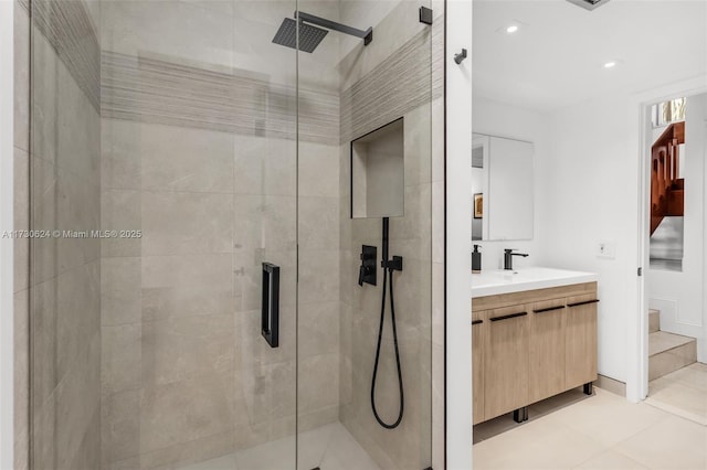 bathroom featuring an enclosed shower, vanity, and tile patterned flooring