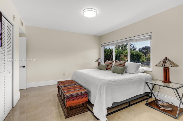 bedroom with light tile patterned floors